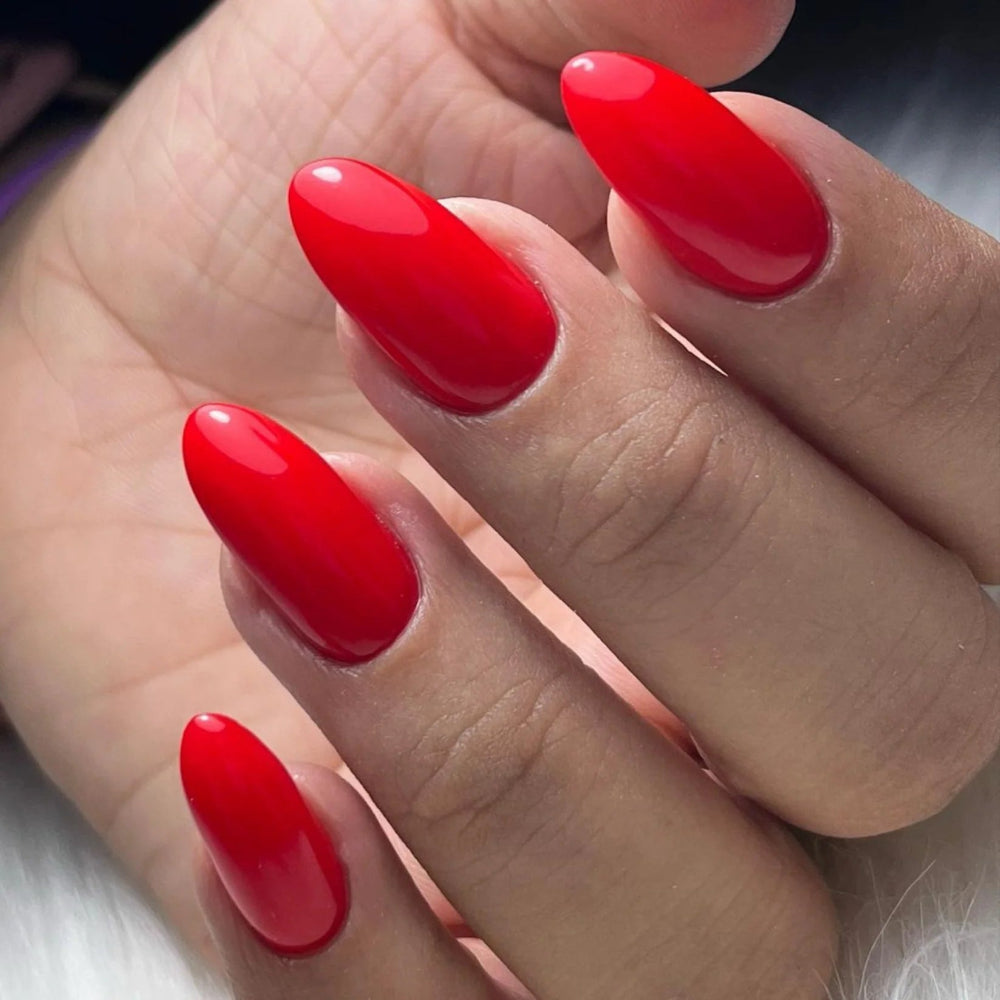 hands wearing DND Duo gel polish 637 Lucky Red