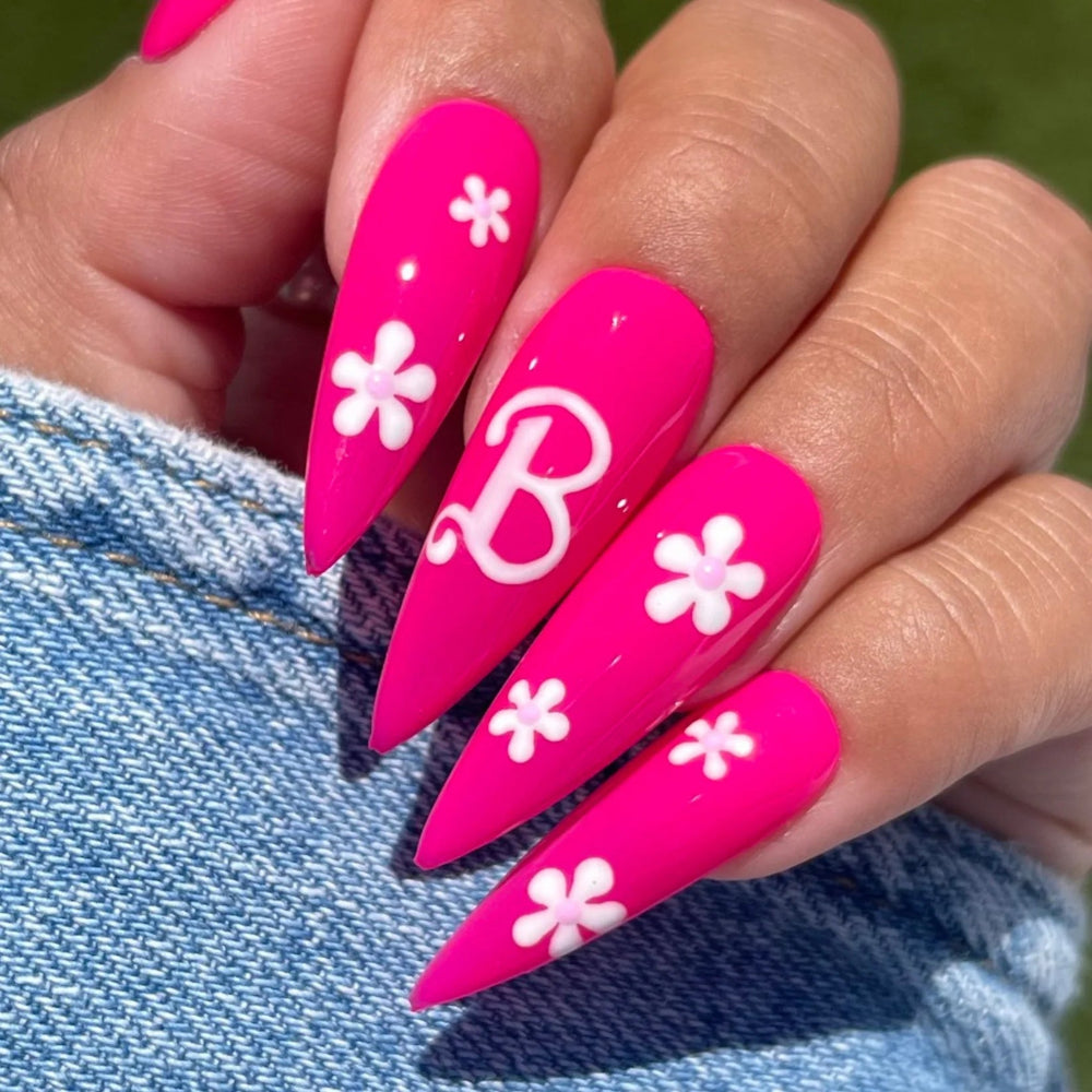 Hands wearing DND Duo gel polish 640 Barbie Pink