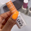 hands wearing DND Duo gel polish 654 Pumpkin Spice