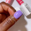 finger wearing DND Duo gel polish 662 kazoo purple