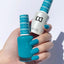 hands wearing DND Duo gel polish 664 Teal Deal