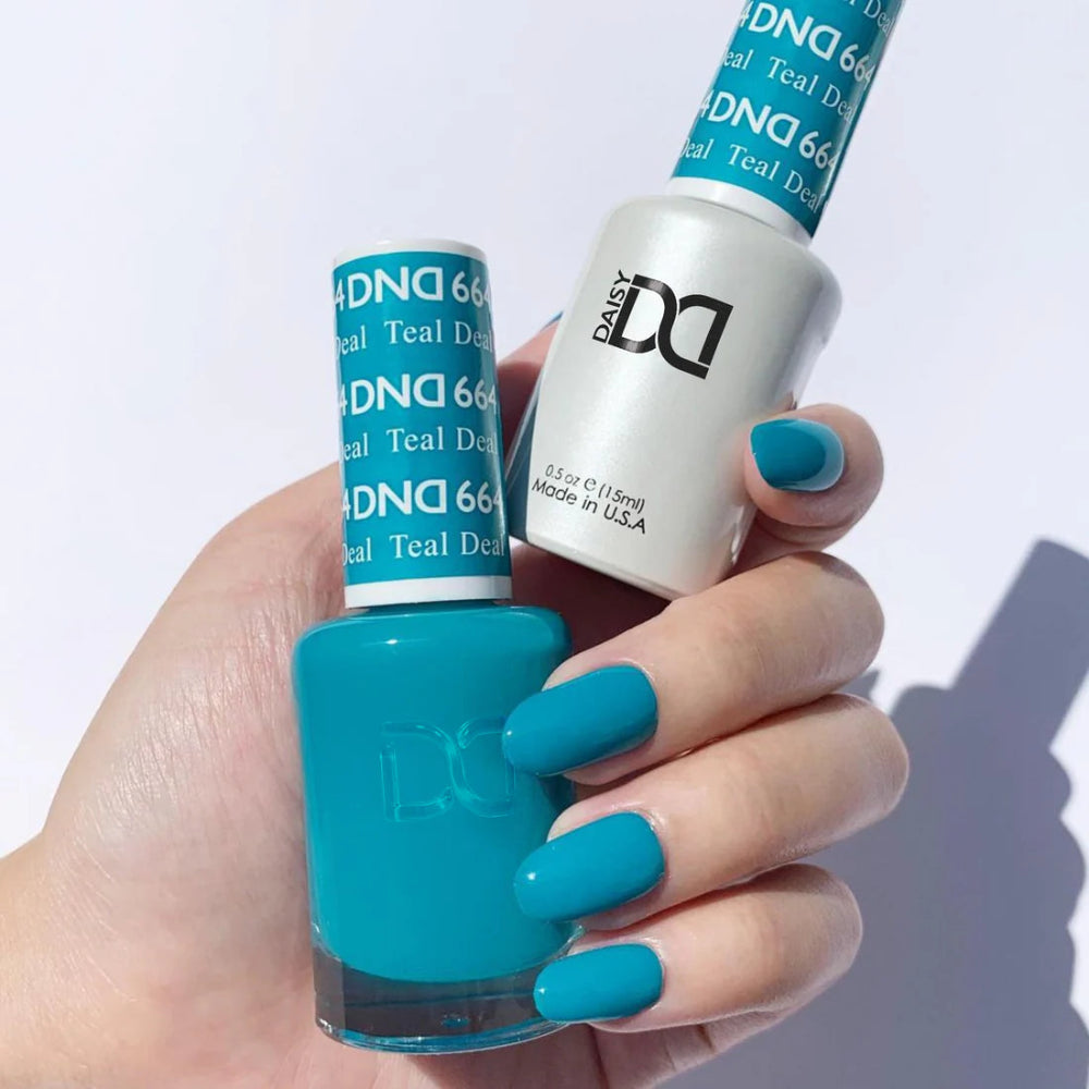 hands wearing DND Duo gel polish 664 Teal Deal
