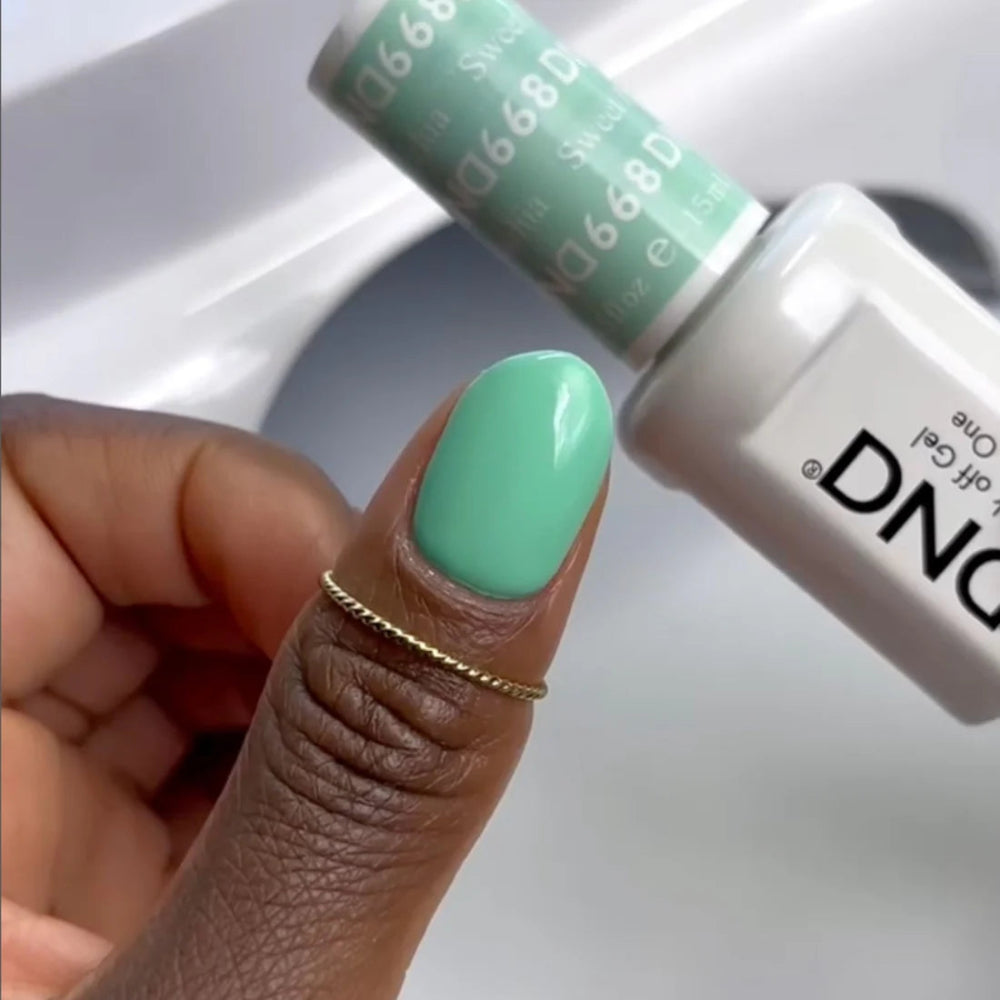 hands wearing DND Duo gel polish 668 Sweet Pistachia