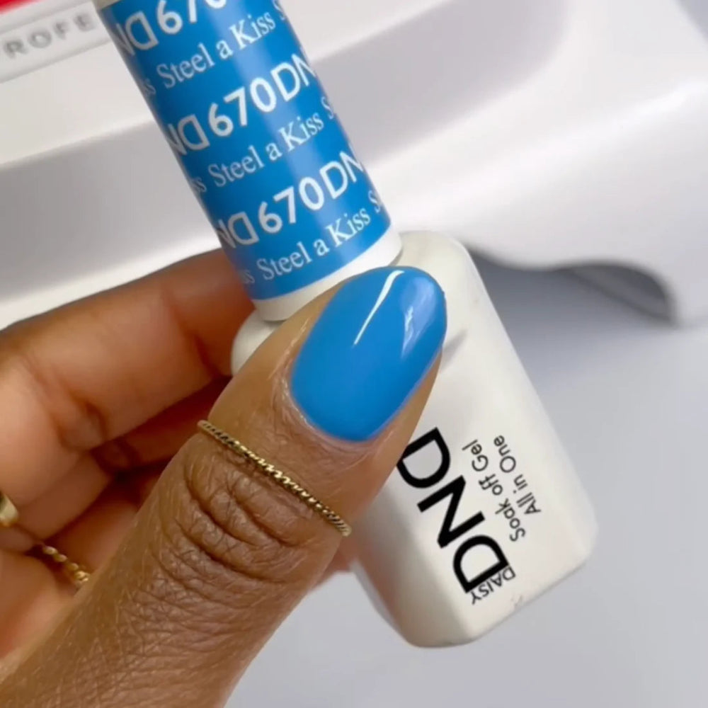 hands wearing DND Duo gel polish 670 Steel a Kiss 