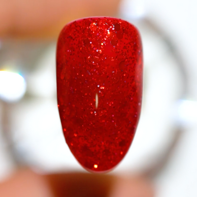 finger swatch of DND Gel Polish - 771 Crimson Sunset