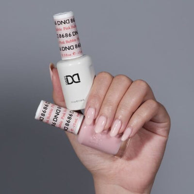 hands wearing 8686 Pink Bubble Gel & Polish Duo by DND