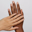 Hands wearing 978 Speakeasy Duo by DND