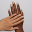 Hands wearing 992 Ceramic Jazz Gel & Polish Duo by DND