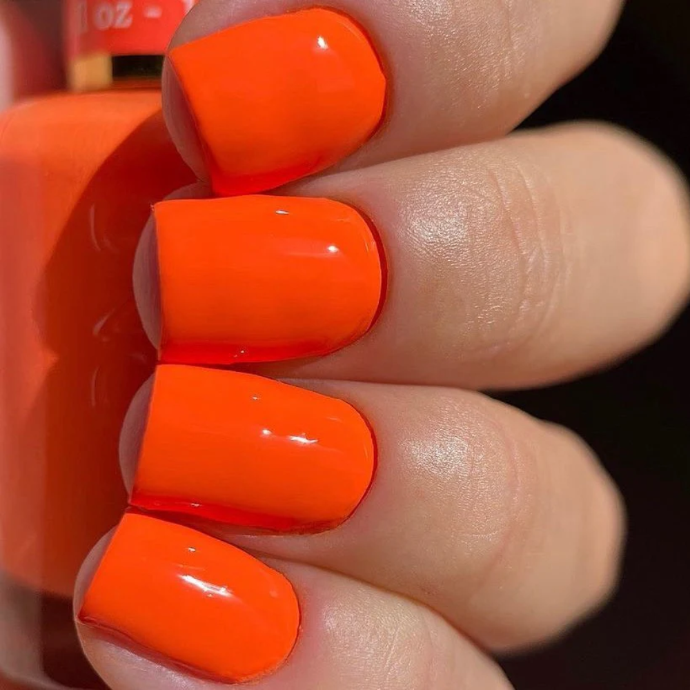 hands wearing DND DC Gel - 010 Dutch Orange