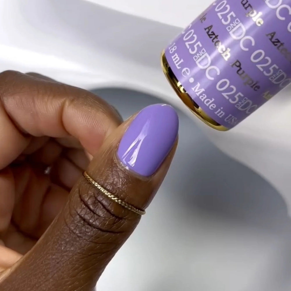 finger wearing DND DC Gel - 025 Aztech Purple