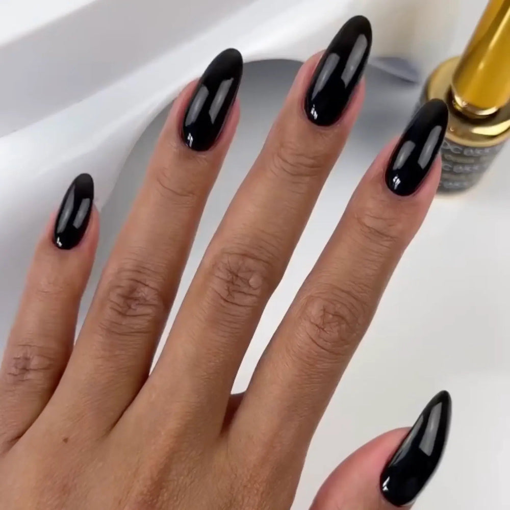 hands wearing DND DC Gel - 055 Black Ocean