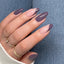hands wearing DND DC Gel - 101 Blue Plum