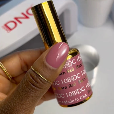 finger wearing DND DC Gel - 108 Barn Red