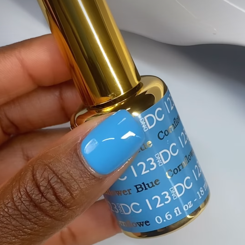 finger wearing DND DC Gel - 123 Cornflower Blue