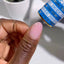 finger wearing DND DC Gel - 145 Light Pink