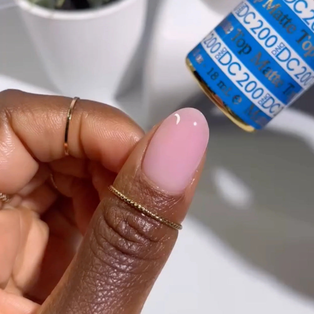 finger wearing DND DC Gel - 145 Light Pink