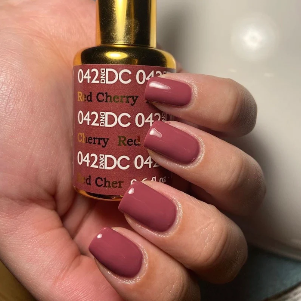 hands wearing DND DC Gel - 042 Red Cherry