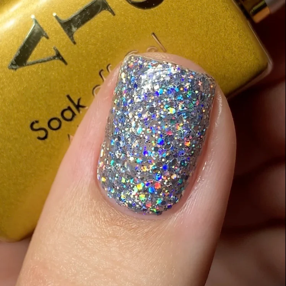 hands wearing 22 Glimmer Galaxy Gel & Polish Diva Duo by DND