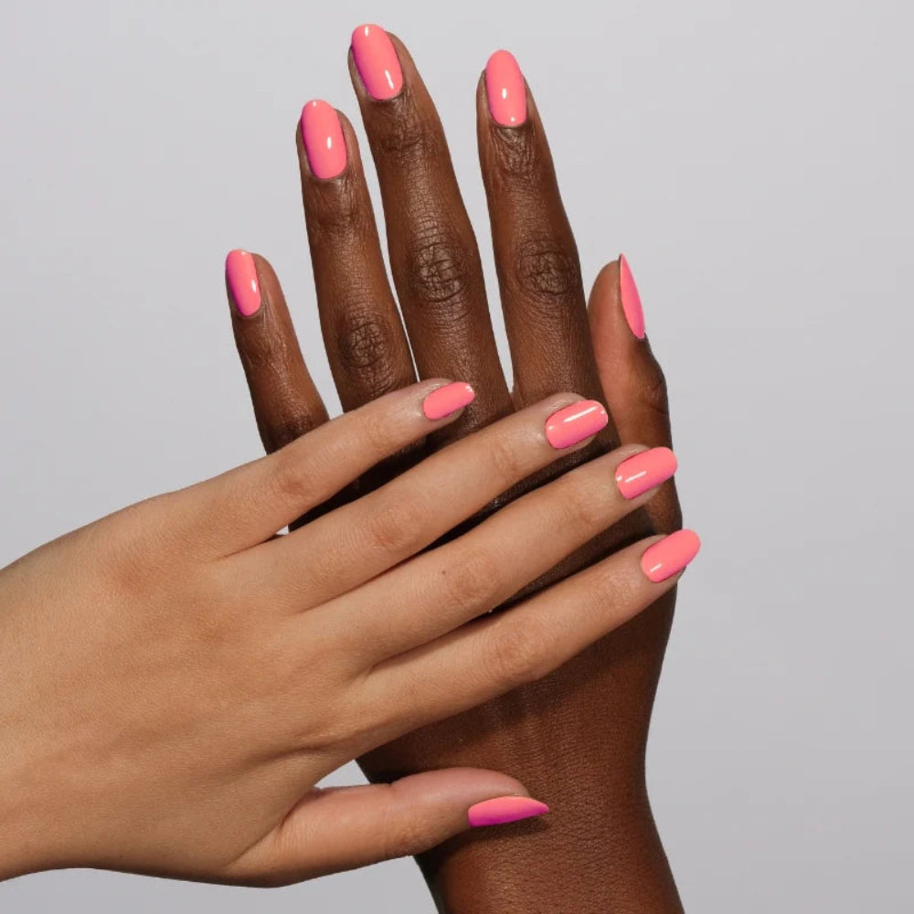 hands wearing DND Diva Gel 175 Coral Sunset