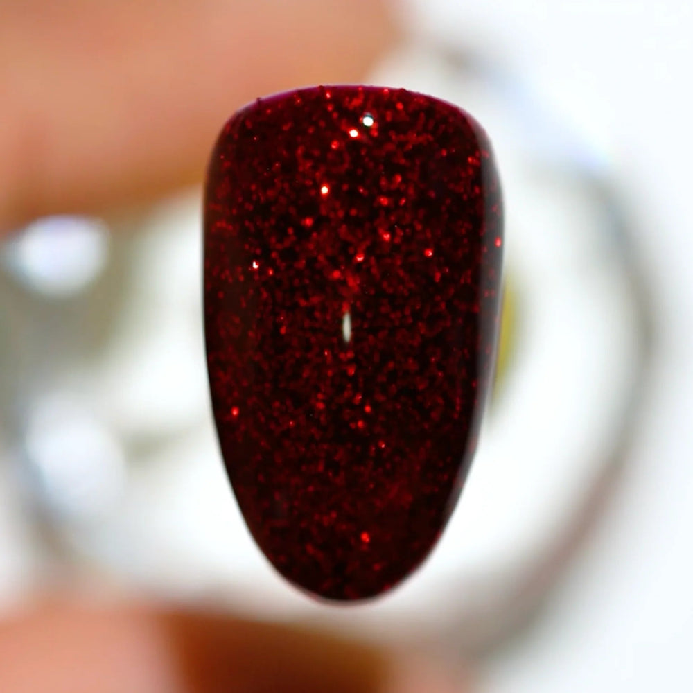 finger wearing DND Gel Polish - 548 Red Carpet