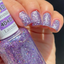 Hands wearing DND Gel 404 Lavender Daisy Star