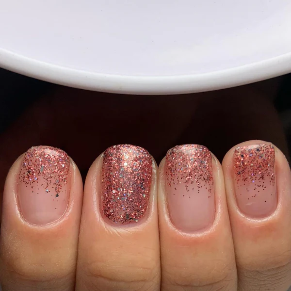 Hands wearing DND Gel 408 Pinky Star