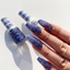 Hands wearing DND Gel  410 Ocean Night Star