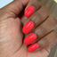 Hands wearing DND Gel 414 Summer Hot Pink