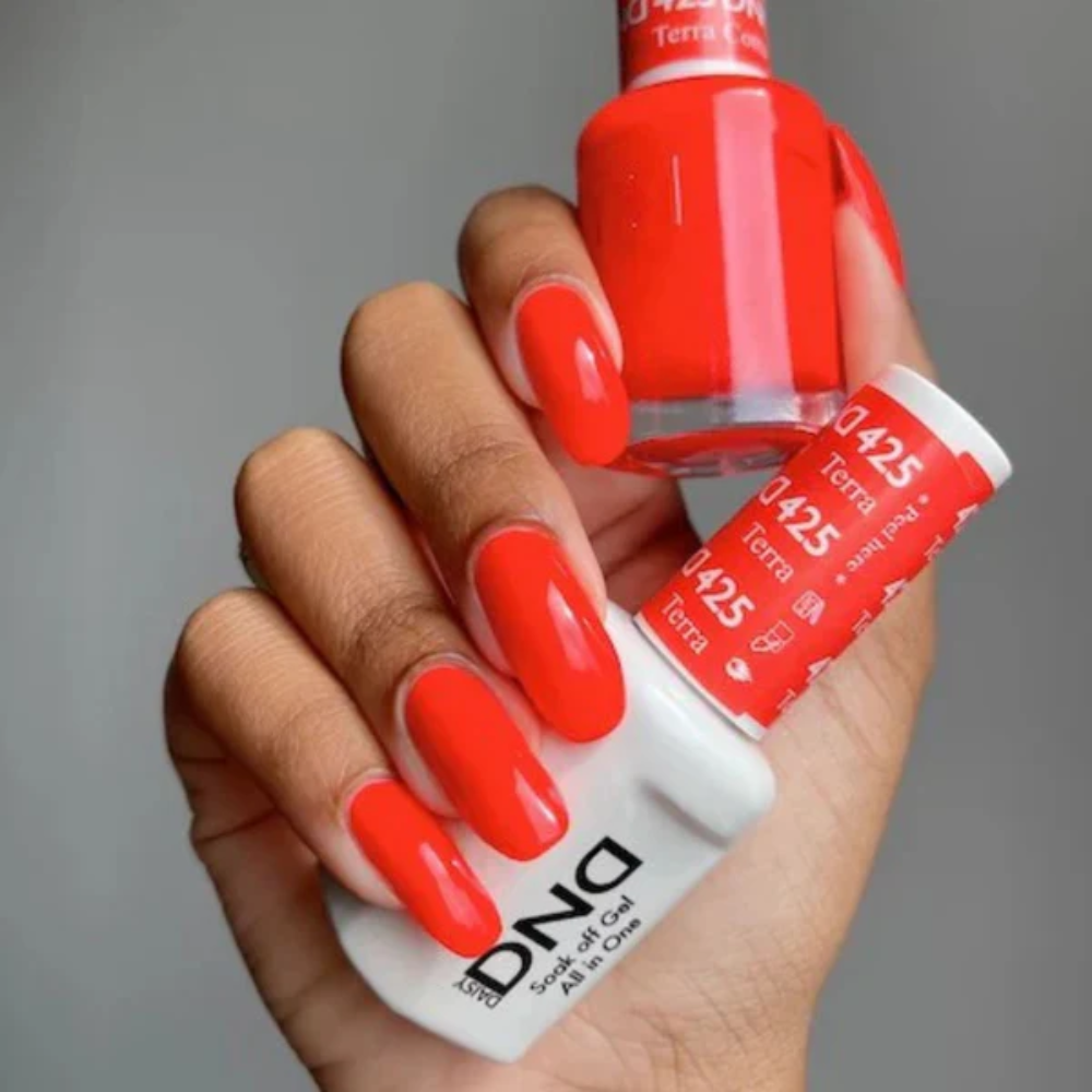 Hands wearing DND Gel 425 Tera Cotta