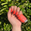 Hands wearing DND Gel 426 Pastel Orange