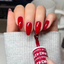Hands wearing DND Gel 429 Boston University Red