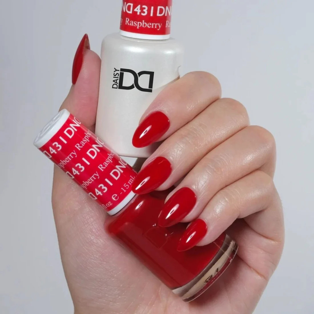 Hands wearing DND Gel 431 Raspberry