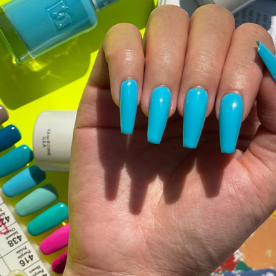 Hands wearing DND Gel 436 Baby Blue