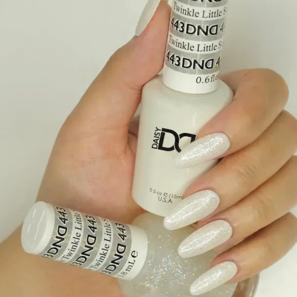 Hands wearing DND Gel 443 Twinkle Little Star
