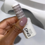 Hands wearing DND Gel 445 Melting Violet