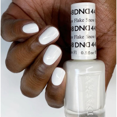 Hands wearing DND Gel 448 Snow Flake