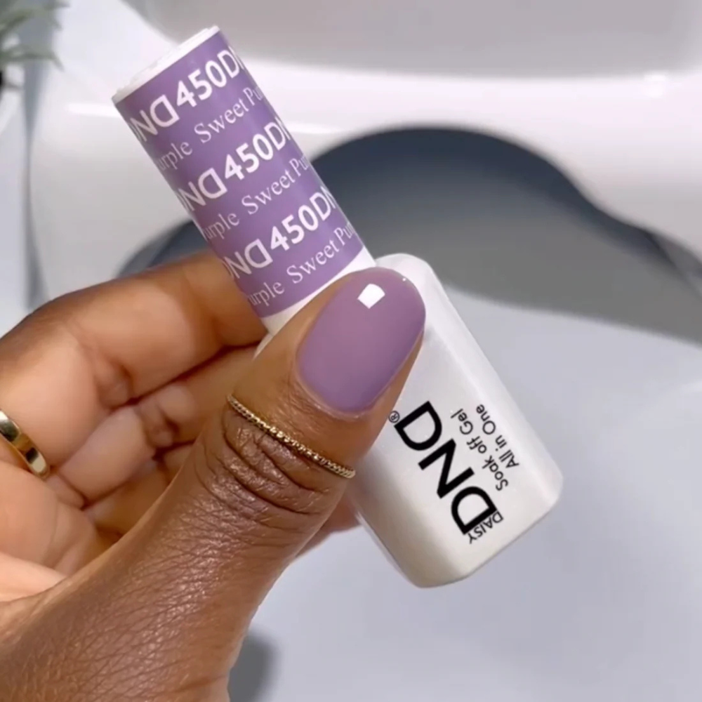 Hands wearing DND Gel 450 Sweet Purple