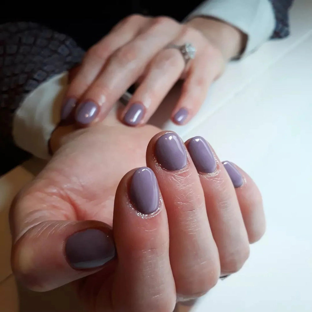hands wearing DND Gel Polish - 489 Antique Purple