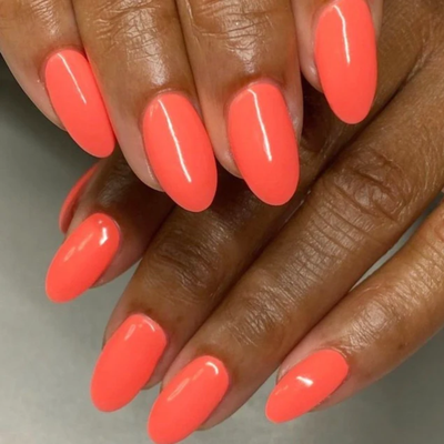 hands wearing color swatch for DND Gel Polish 503 Orange Smoothie
