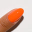 finger wearing DND Gel Polish 713 Orange Sherbet