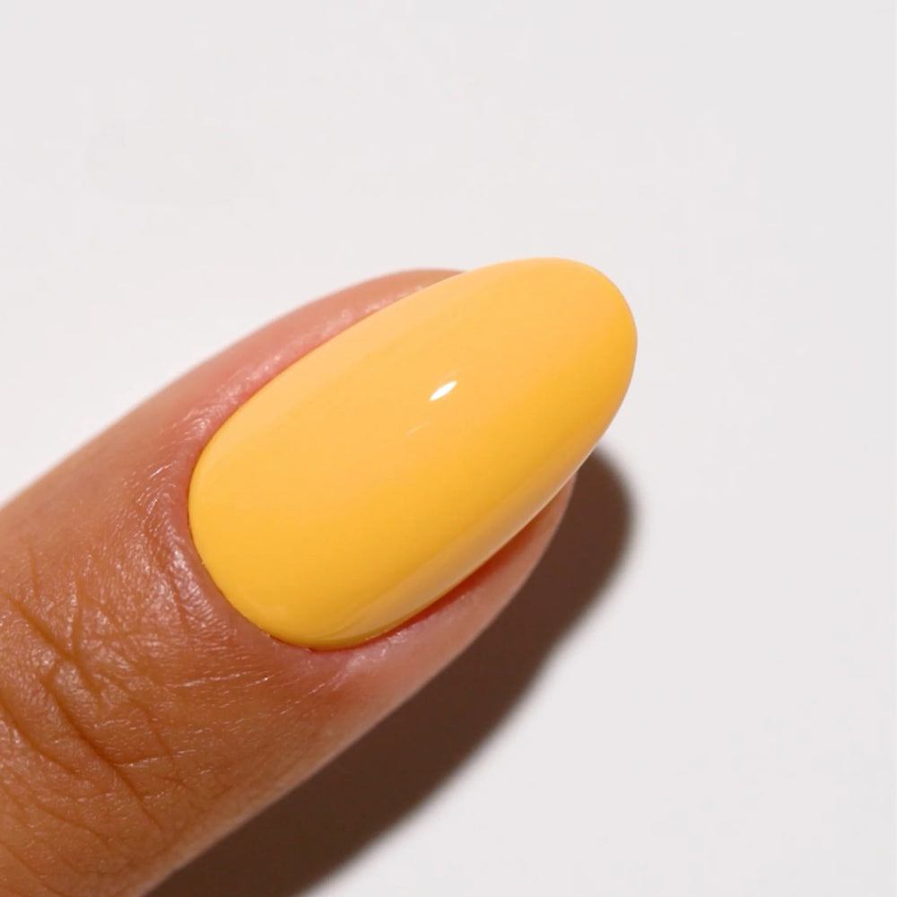 finger wearing DND Gel Polish 745 Honey