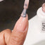 finger wearing DND Gel Polish - 887 Glass Peach