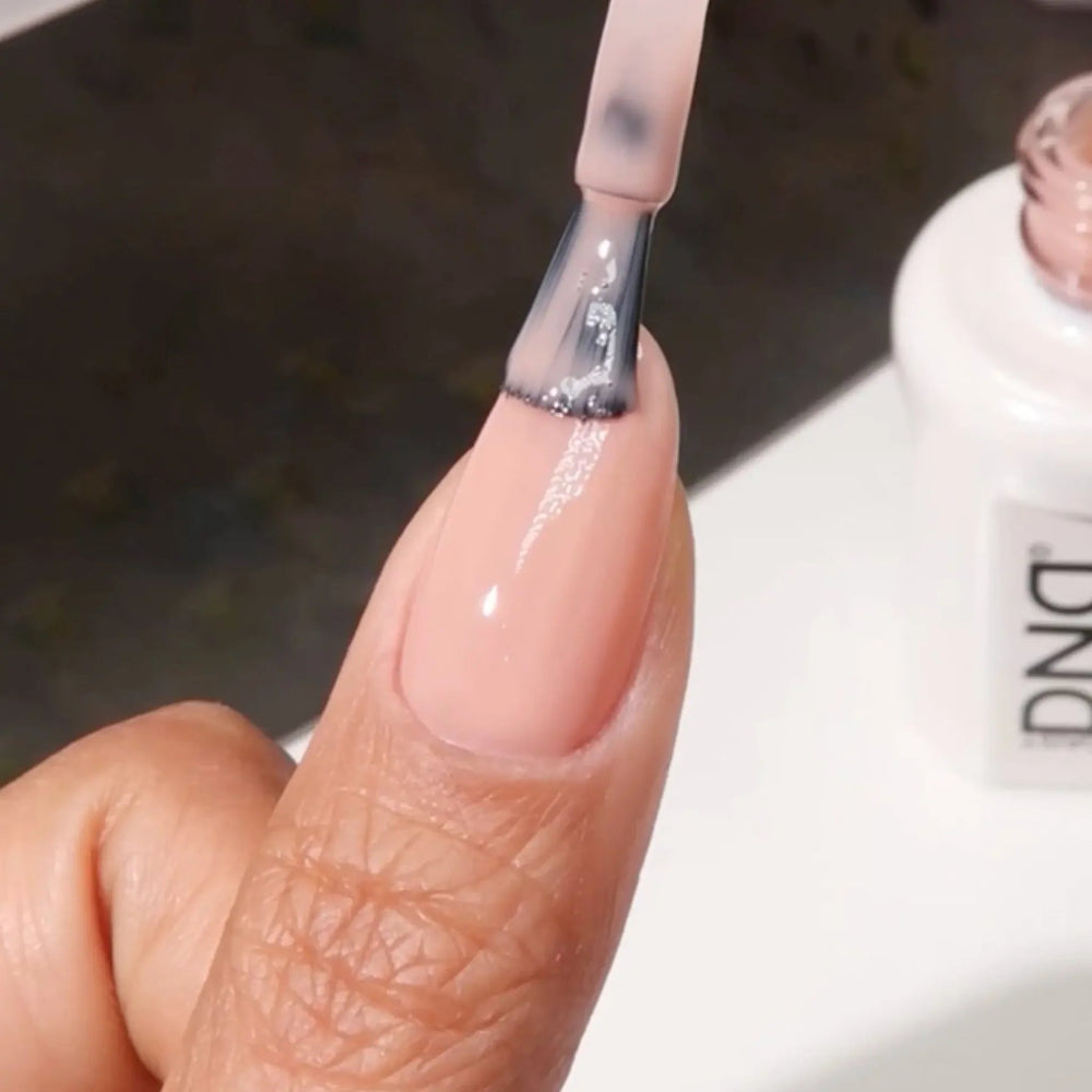 finger wearing DND Gel Polish - 887 Glass Peach