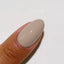 finger wearing DND Gel Polish - 983 Slinky Taupe