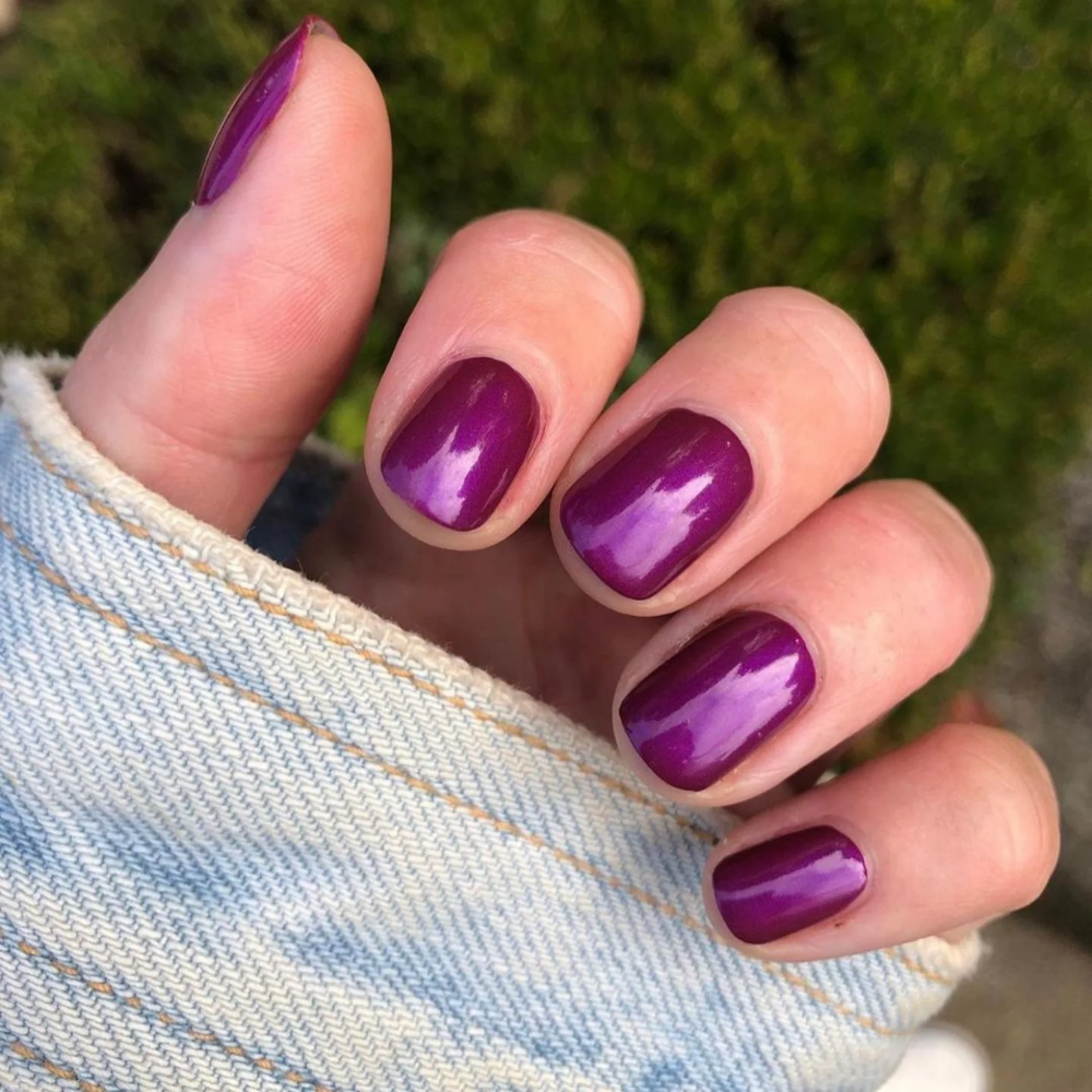 hands wearing DND Gel Polish 703 Purple Glass 