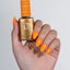 hand wearing 207 Sunset Creamsicle Gel & Polish Diva Duo by DND
