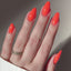 hands wearing 210 Sunkissed Coral Gel & Polish Diva Duo by DND