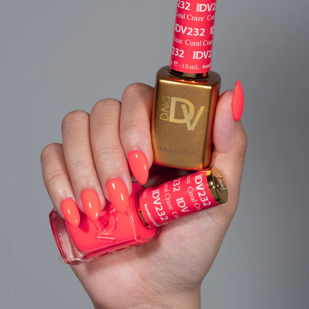 hands wearing 232 coral craze Diva Gel & Polish Duo by DND