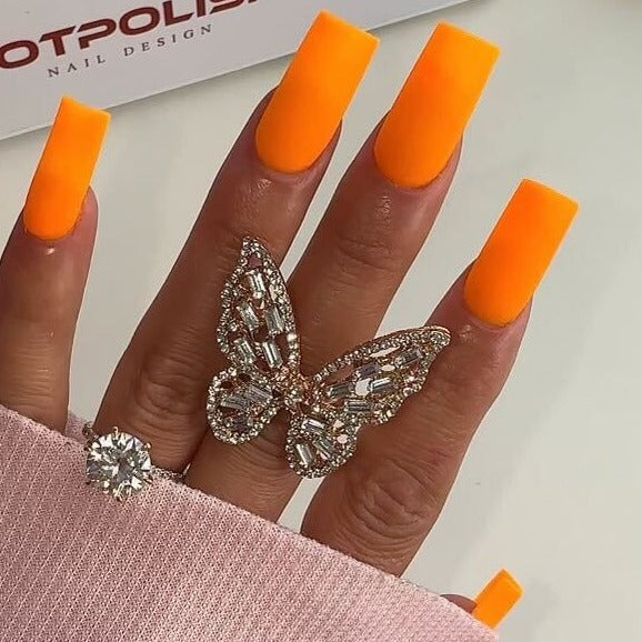 hands wearing OG223 Orange U Cute Gel & Polish Duo by Notpolish