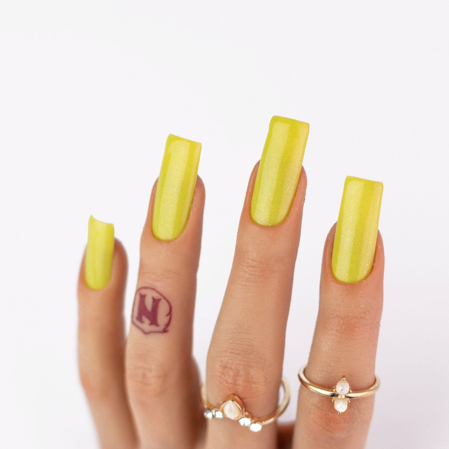 hands wearing M094 Sunlit Yellow Matching Trio by Notpolish